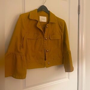 Anthropologie. NORA flounce sleeve trucker cropped jacket in mustard yellow